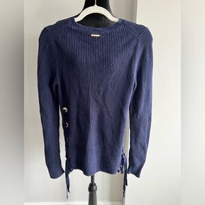 Navy Michael Kors sweater with bows on the sides.